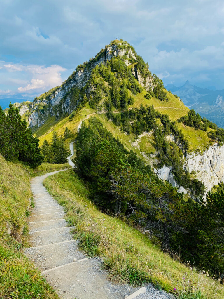 Mountain trail in Swiss Alps in sunny day