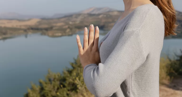 Side view woman meditating nature