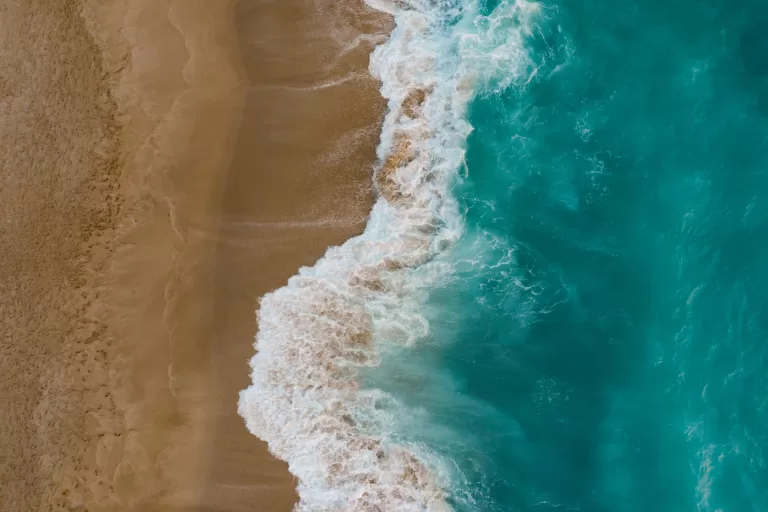 Top view sand meeting seawater