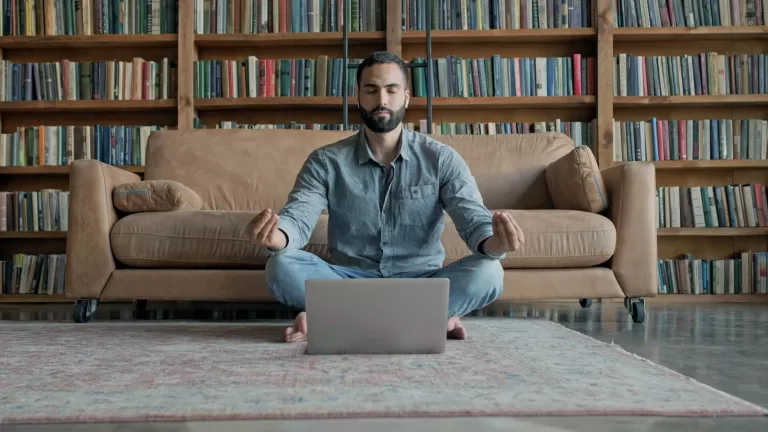 Man meditation laptop
